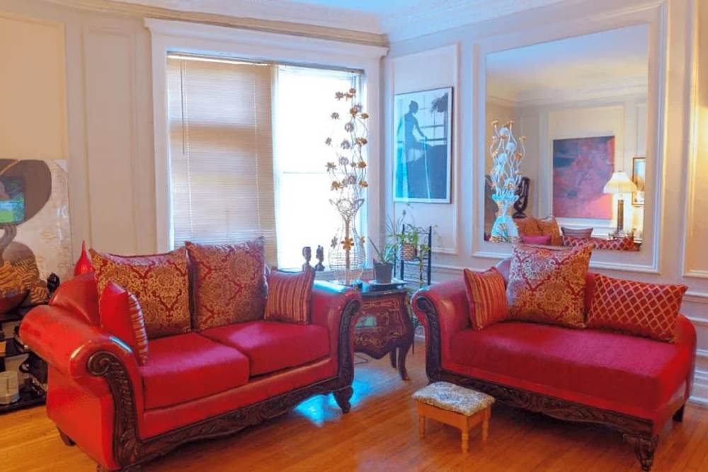 Living room with red furniture at Detroit Living in Detroit,Michigan