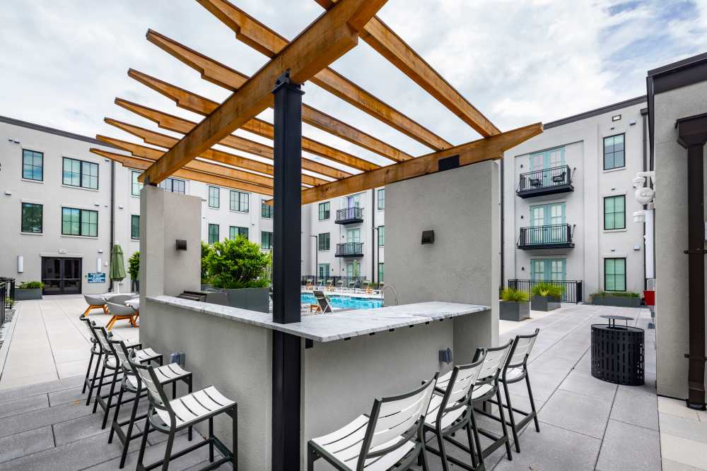 Bar seating around the outdoor grilling station at The Lowe in Savannah, Georgia