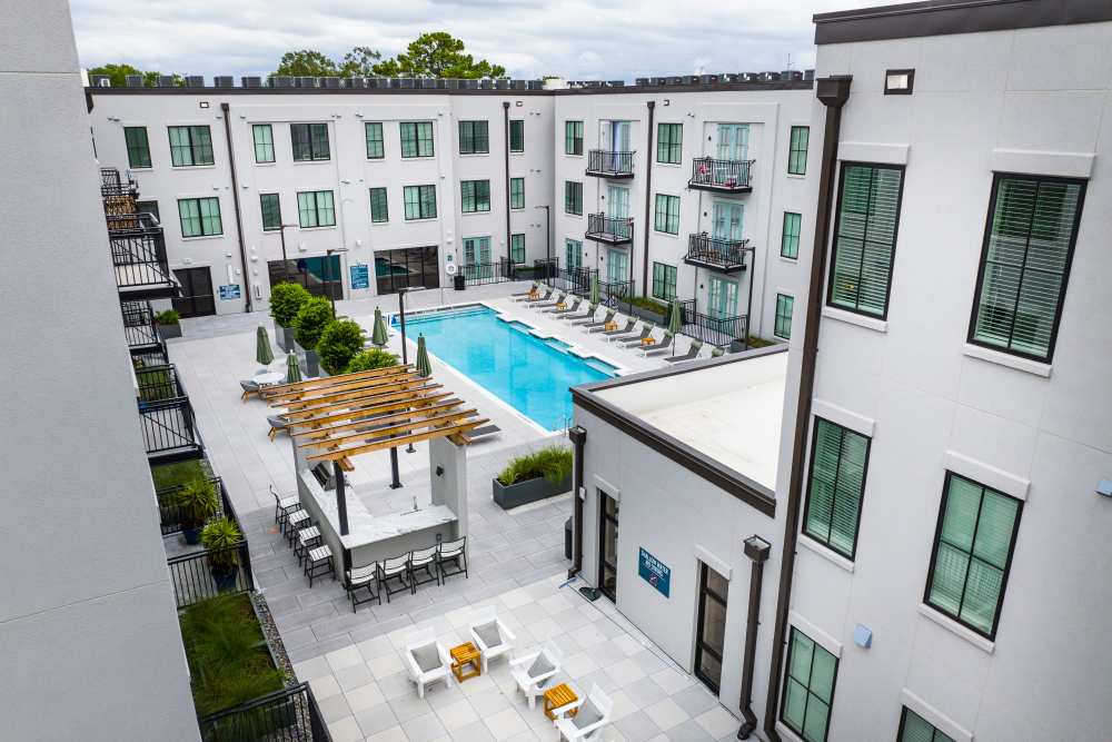 Aerial view of apartment buildings and swimming pools at The Lowe in Savannah, Georgia