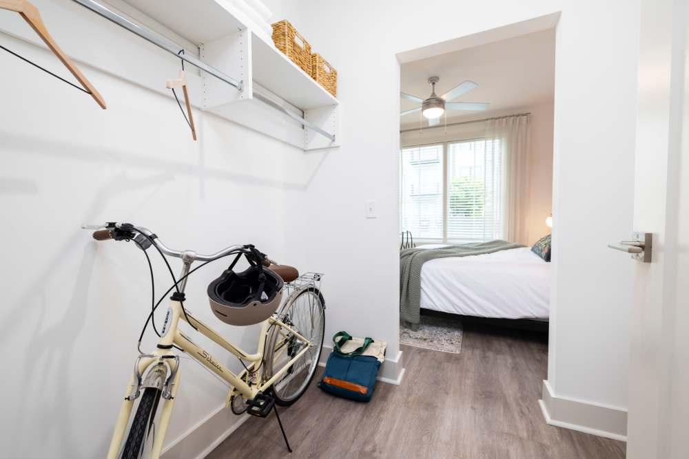 Large walk-in closet storing a bicycle in a model home at The Lowe in Savannah, Georgia
