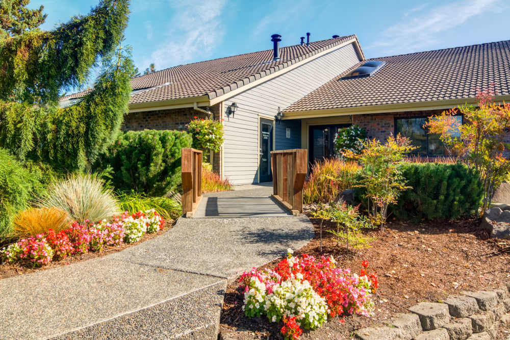 Entrance of the apartment with tree all around at Ansley Murrayhill in Tigard, Oregon