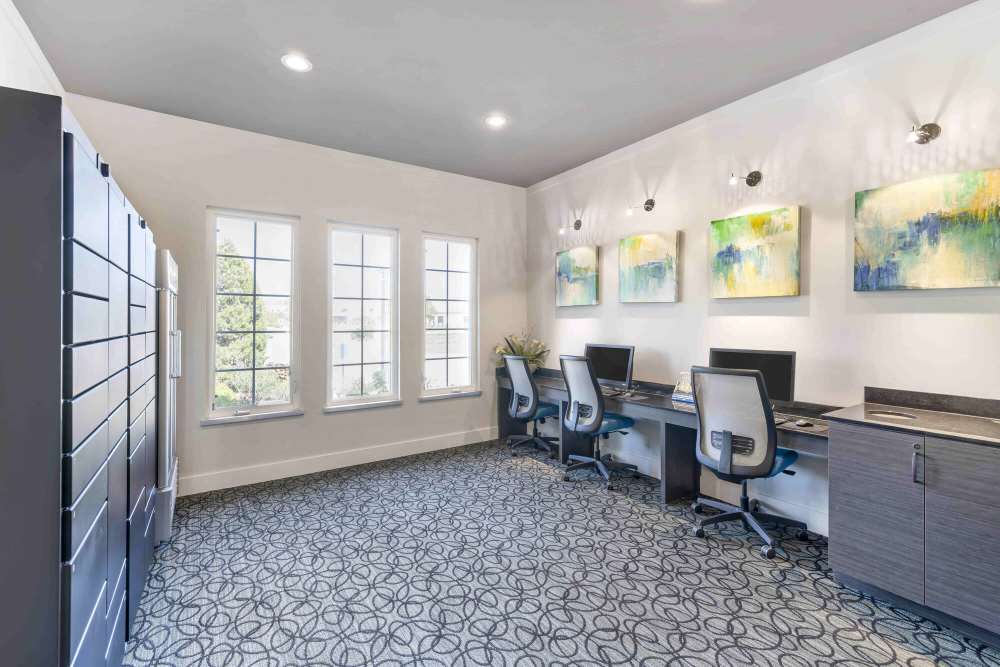 Business center with multiple desktops and multiple storage units at Eastland Trails in Independence, Missouri