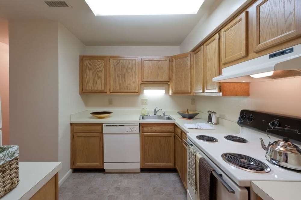 Cozy kitchen with white appliances at Smallwood Gardens in Waldorf,Maryland