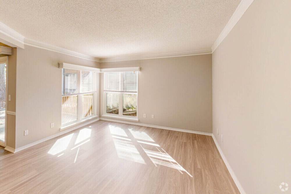 Bright living room with large windows at Crickentree in Mt Pleasant, South Carolina,