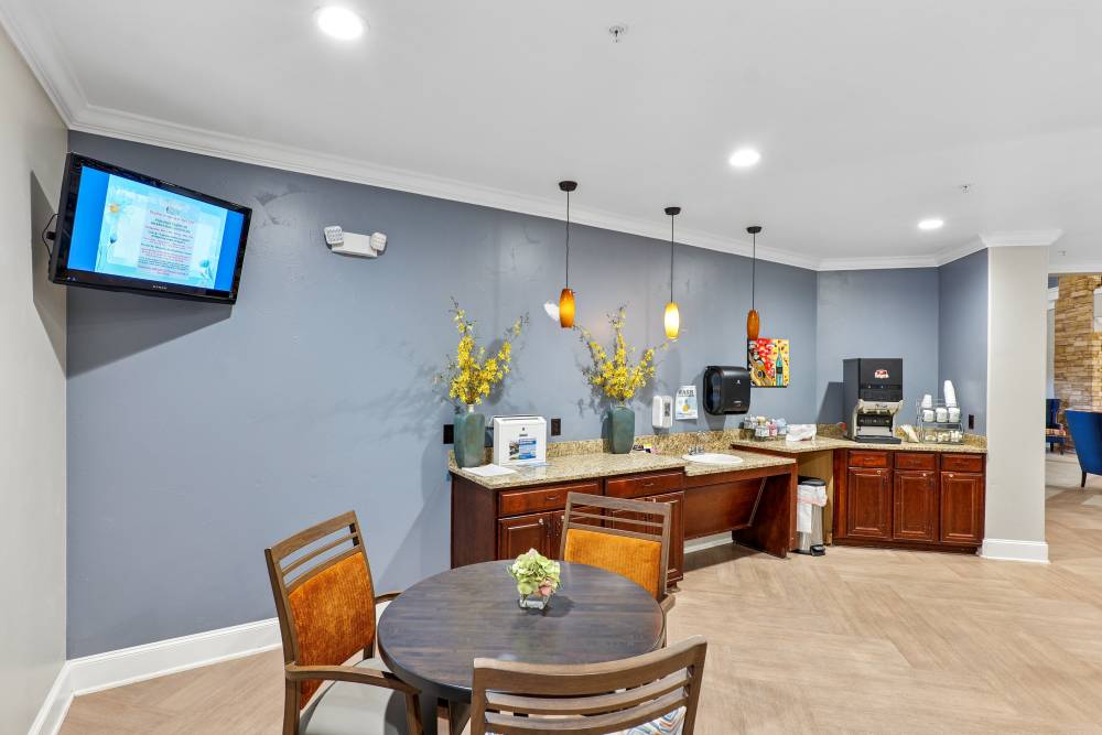 A kitchen with island table at Watercrest at Bryan in Bryan, Texas