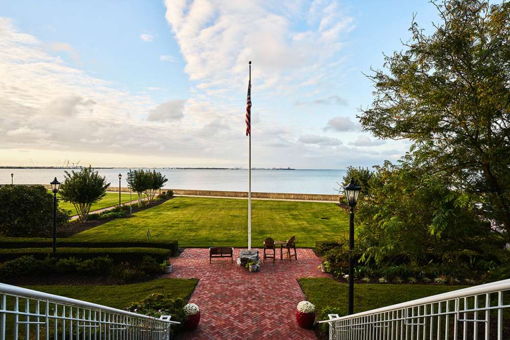 View of the Chesapeake Bay and American flag at The Chamberlin in Hampton, Virginia