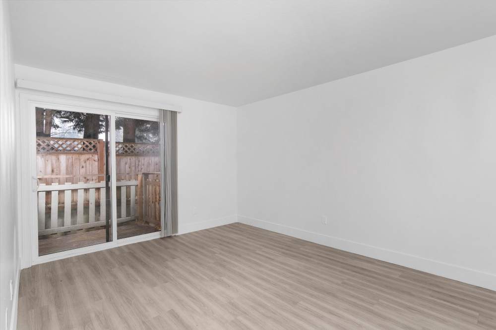 Room with balcony access at The Rosewood Apartments in Vancouver, Washington