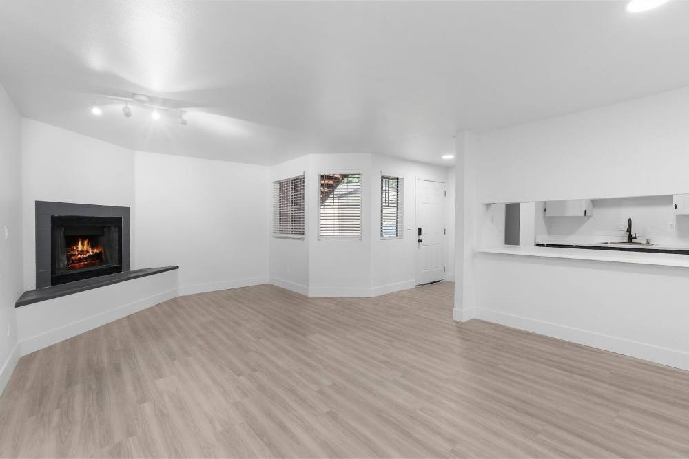 Spacious living room with fireplace at The Rosewood Apartments in Vancouver, Washington