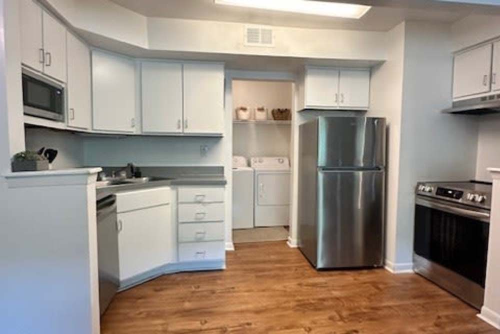 Kitchen with Wood Flooring at The Quarters Starkville in Starkville, Mississippi