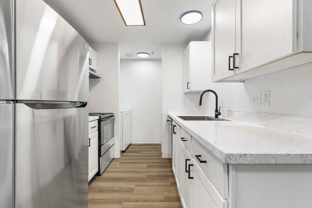 Kitchen with wood-style flooring at Reedville Meadows in Beaverton, Oregon