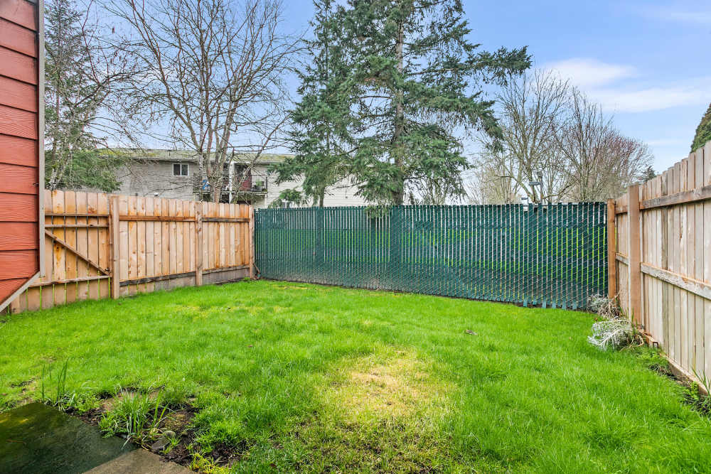 Fenced green lawn at Reedville Meadows in Beaverton, Oregon
