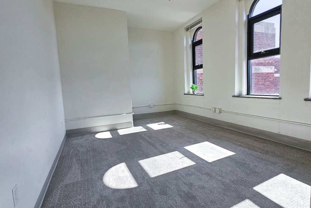 Light from the arched windows in an apartment at Academy Manor in Grand Rapids, Michigan