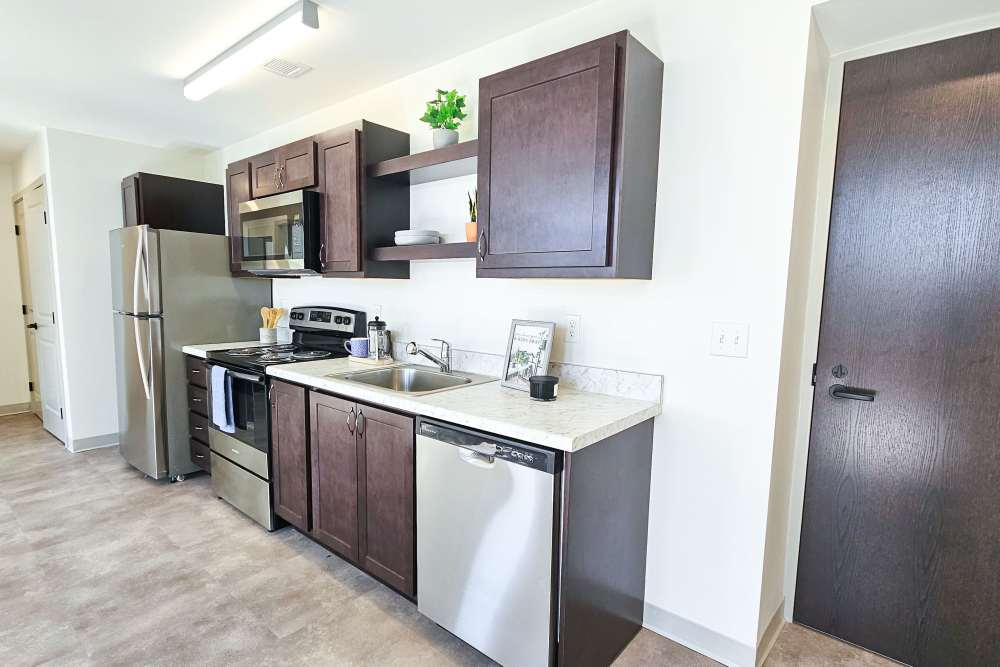 Stainless-steel appliances in a kitchen at Academy Manor in Grand Rapids, Michigan