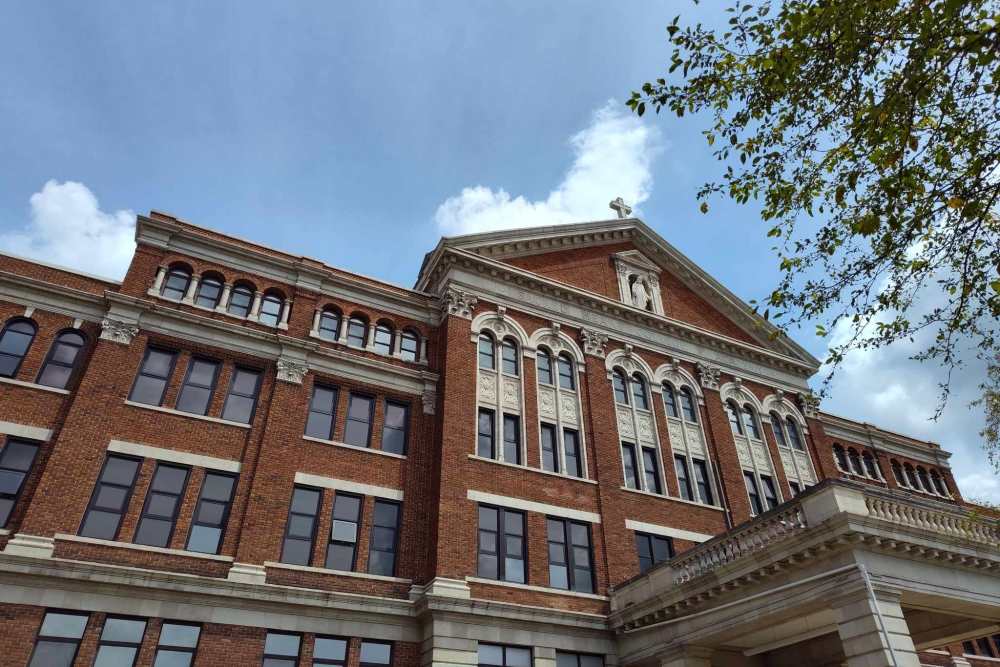 Exterior of the brick apartment building at Academy Manor in Grand Rapids, Michigan