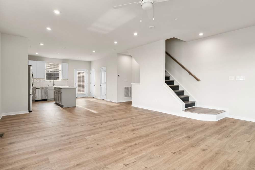 First floor living room and stairs in a townhome at The Westbrook at Brewer's Row in Richmond, Virginia