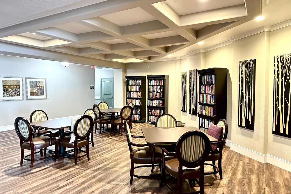 Cozy movie room with rows of plush seating and a large screen inviting viewers to relax and enjoy a cinematic experience