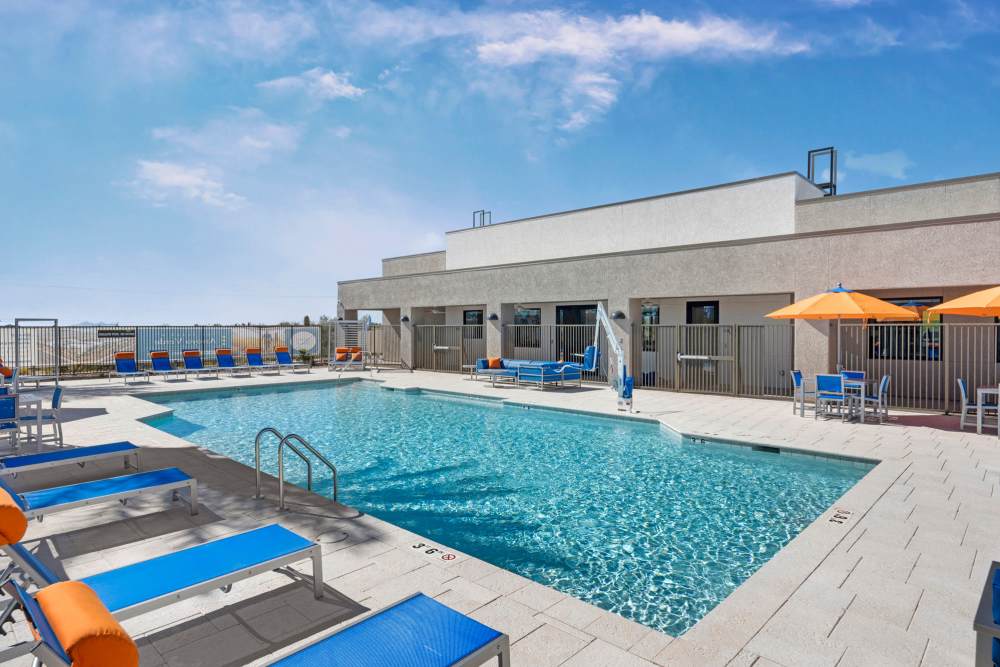 Pool area with lounge chair at Olympus at Arroyo Verde in Tucson, Arizona
