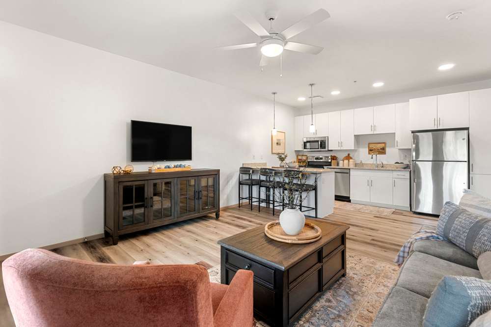 Living room with view to kitchen at Olympus at Arroyo Verde in Tucson, Arizona