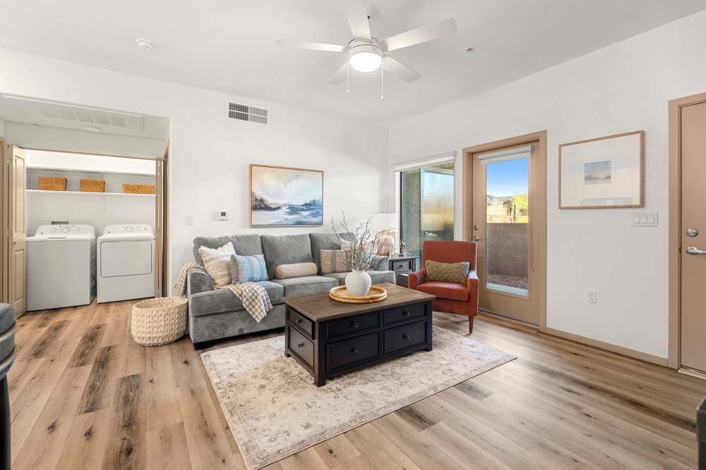 Living room with sofa and center table at Olympus at Arroyo Verde in Tucson, Arizona