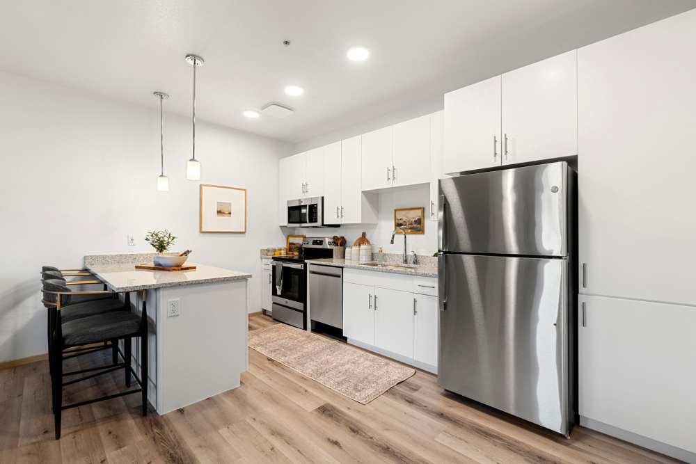 Kitchen with hanging light at Olympus at Arroyo Verde in Tucson, Arizona
