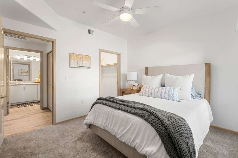 Bedroom with attached bathroom at Olympus at Arroyo Verde in Tucson, Arizona