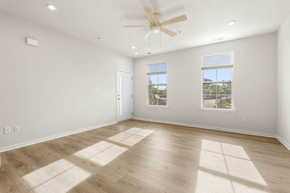 Spacious room with ceiling fan and windows at The Westbrook at Brewer's Row in Richmond, Virginia
