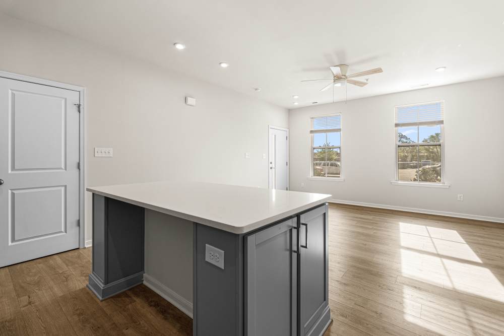 Townhome kitchen island with granite countertops at The Westbrook at Brewer's Row in Richmond, Virginia