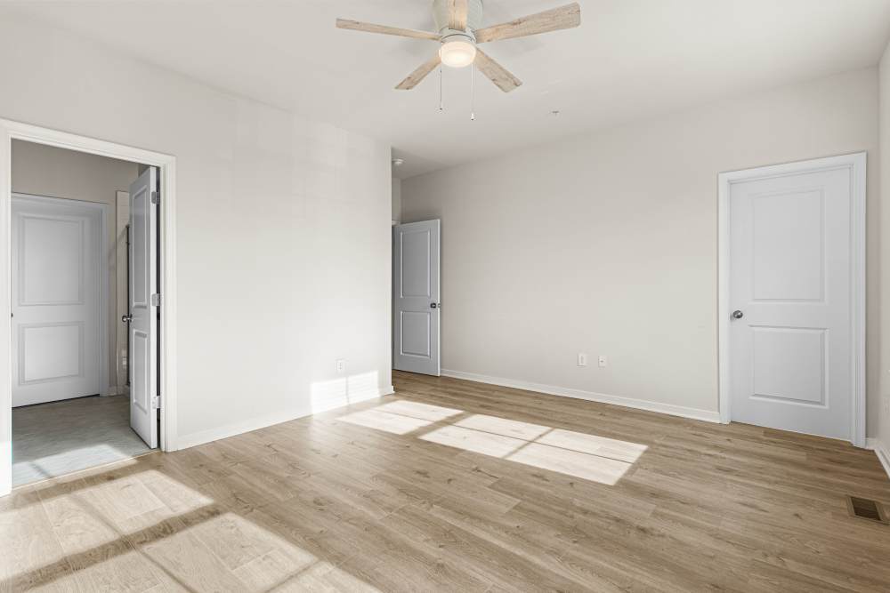 Bedroom with large closet and ceiling fan at The Westbrook at Brewer's Row in Richmond, Virginia