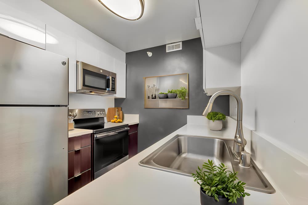 Apartment kitchen with dual basin sink at Promenade Towers in Los Angeles, California