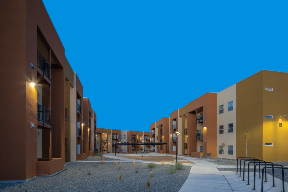 Sidewalk between buildings at 550 Paseo Apartments in Rio Rancho, New Mexico