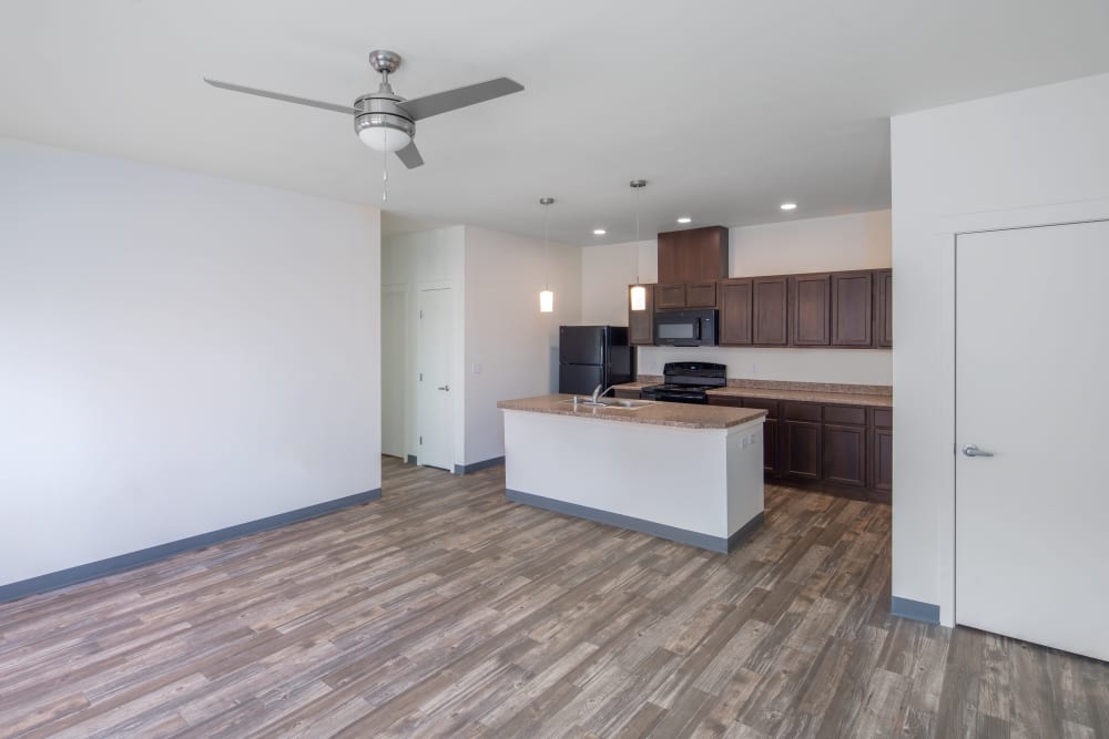 Kitchen and living room at 550 Paseo Apartments in Rio Rancho, New Mexico