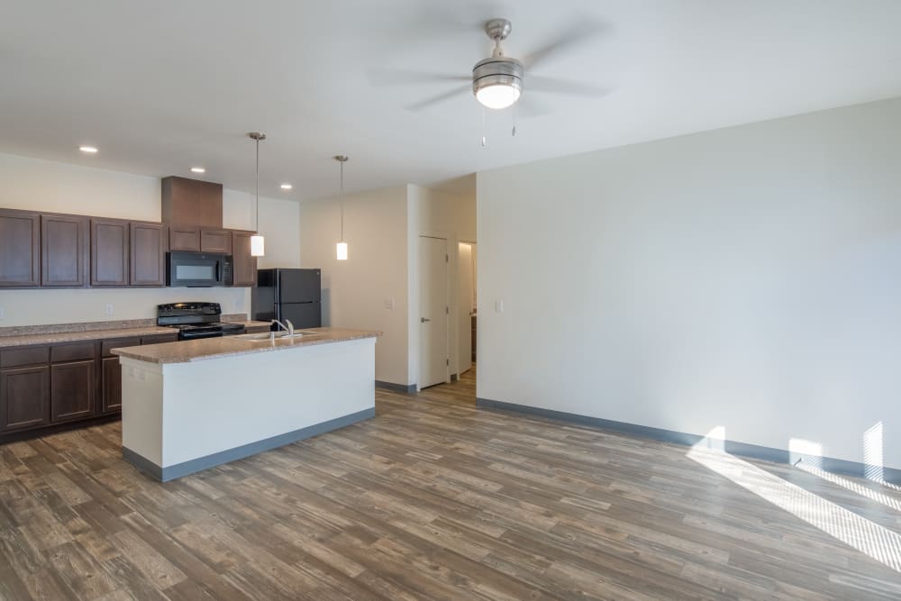 Kitchen and living room at 550 Paseo Apartments in Rio Rancho, New Mexico