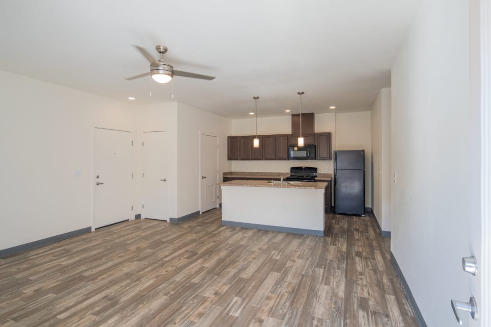 Kitchen and living room at 550 Paseo Apartments in Rio Rancho, New Mexico