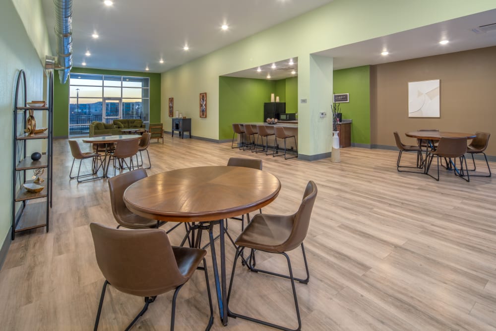 Clubhouse tables and chairs at Casa de Encantada Senior Apartments in Rio Rancho, New Mexico