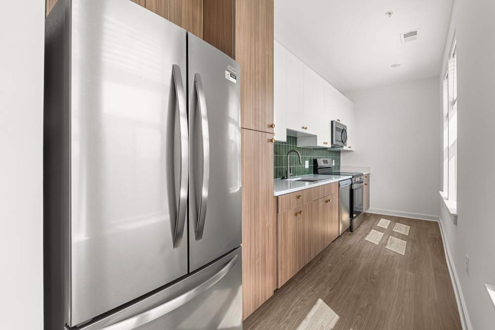 Kitchen with french-door refrigerator at The Alder on Dabney in Richmond, Virginia