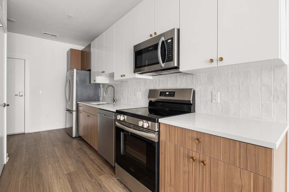 Kitchen with above-range microwave at The Alder on Dabney in Richmond, Virginia