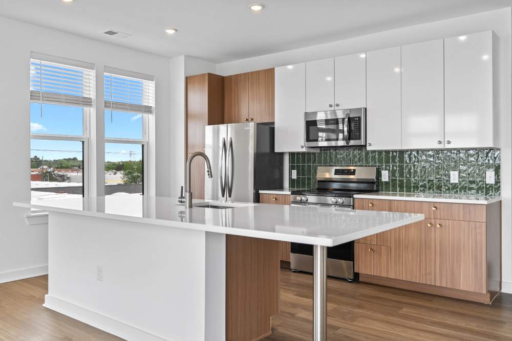 Kitchen with green tile backsplash  at The Alder on Dabney in Richmond, Virginia