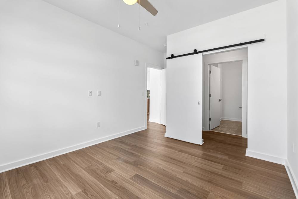Bedroom with closet and ceiling fan at The Alder on Dabney in Richmond, Virginia