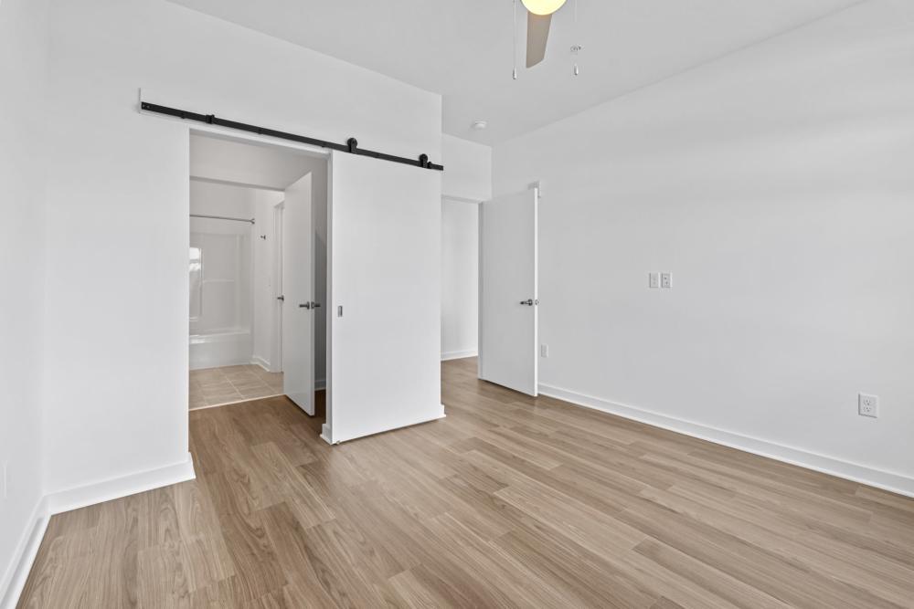 Bedroom with bathroom and closet at The Alder on Dabney in Richmond, Virginia