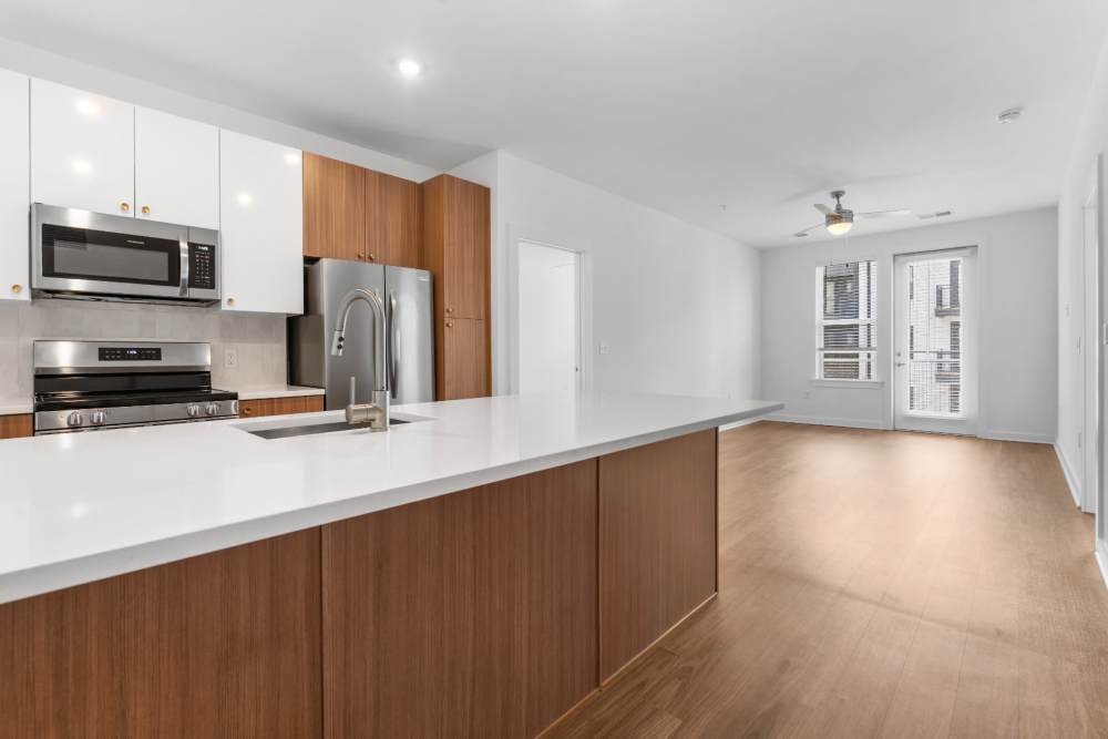 Kitchen with island and quartz countertops at The Alder on Dabney in Richmond, Virginia