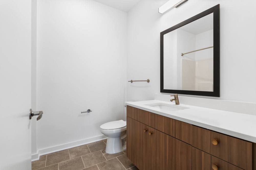 Bathroom with toilet and vanity at The Alder on Dabney in Richmond, Virginia