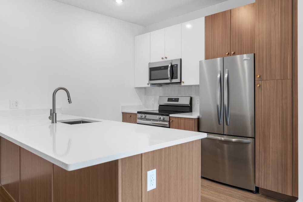 Kitchen with french-door refrigerator and ice maker at The Alder on Dabney in Richmond, Virginia