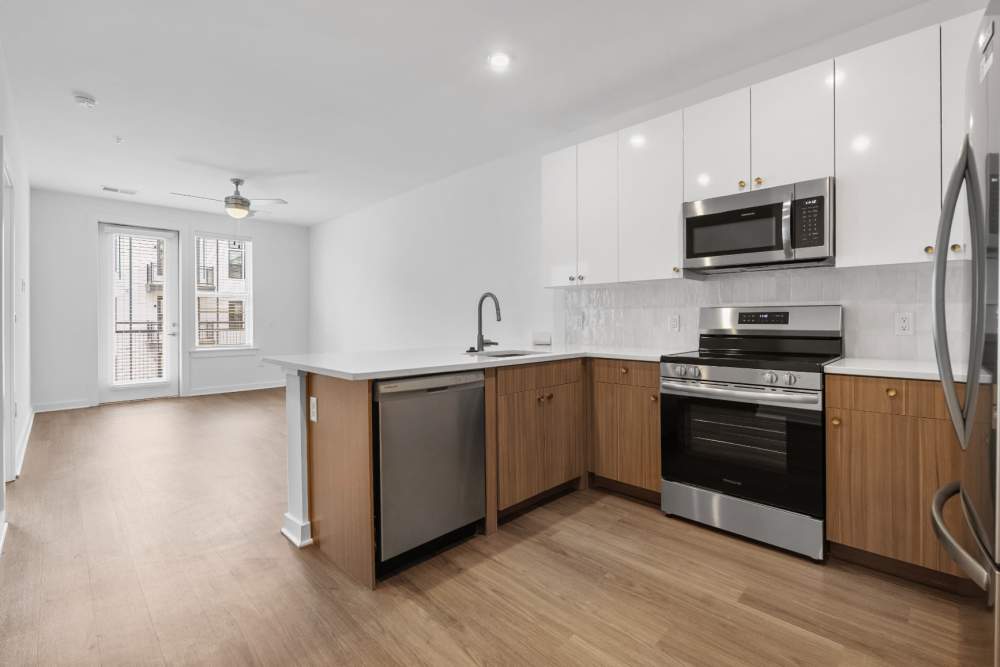 Spacious kitchen with stainless steel appliances at The Alder on Dabney in Richmond, Virginia