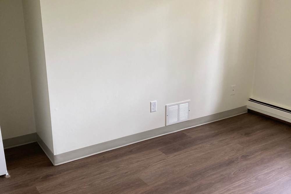 Unfurnished bedroom at Village Apartments in Bellaire, Michigan