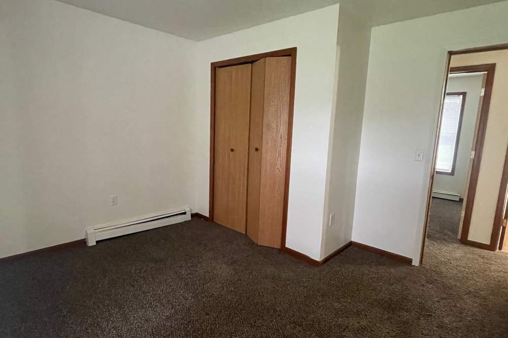 Viewof bedroom with plush carpeting at Trinity Buena Vista in Saint Charles, Michigan,