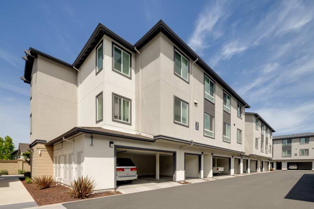 Apartment outdoor pathway at Village at First in Gilroy, California