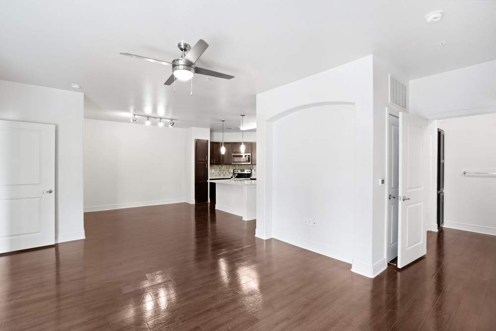 Spacious living room with ceiling fan at Trinity Bluff & Trinity District in Fort Worth, Texas