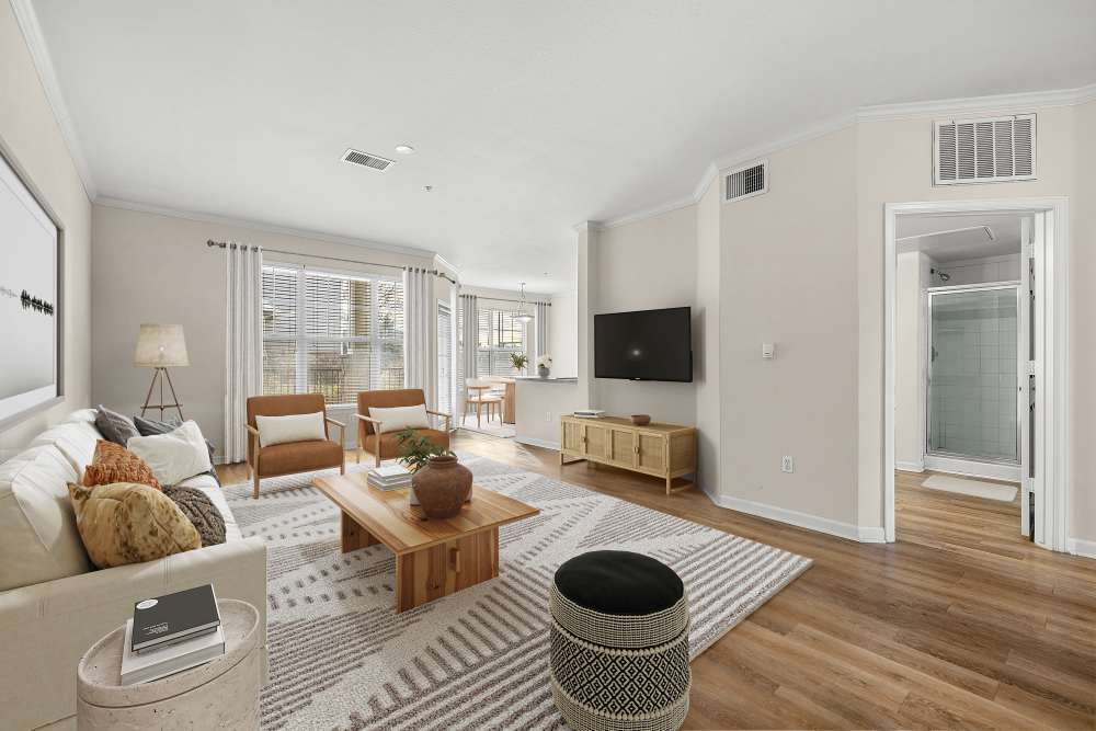 Large open layout living room with hardwoodstyle flooring at Briargate on Main in Parker, Colorado