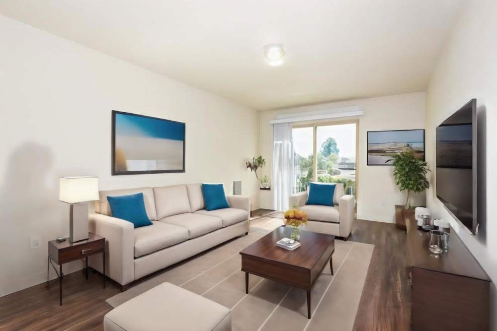 Living room with a sliding door at Blanton Commons in Beaverton, Oregon