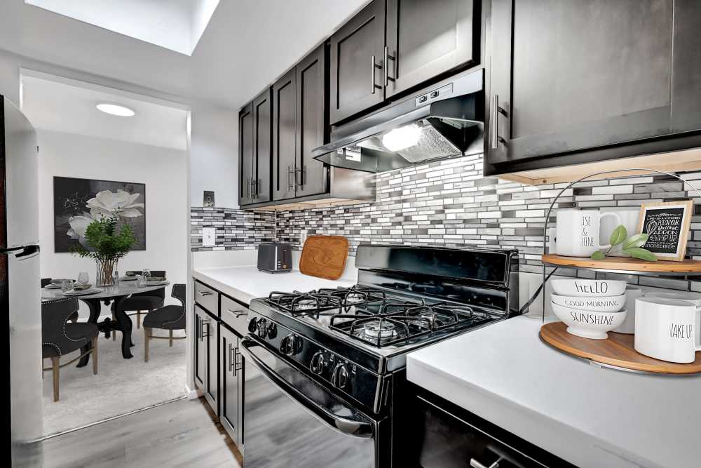 Modern kitchen with wooden cabinets at Eden at Jefferson Crossing in Columbus, Ohio